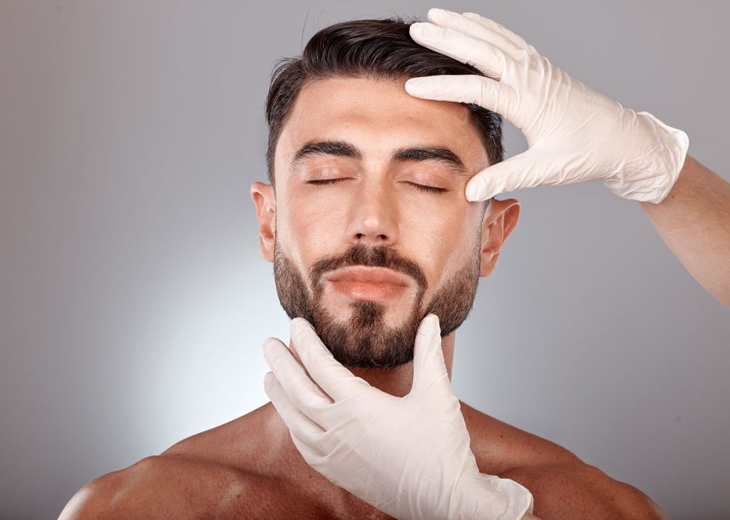 Plastic surgery, cosmetics and man with doctor hands in studio mockup for botox, aesthetic or facial dermatology for medical or beauty. Mesotherapy, hyaluronic acid or collagen of young model faceInjections de Botox à Paris : traitement des rides d’expression - Dr Grégory Staub – Chirurgien esthétique